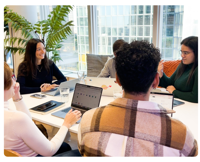 people having a meeting around a table